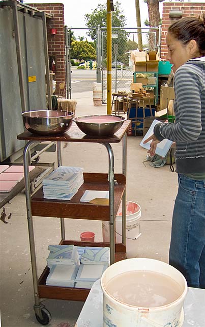 Pignolet applying glaze to tiles